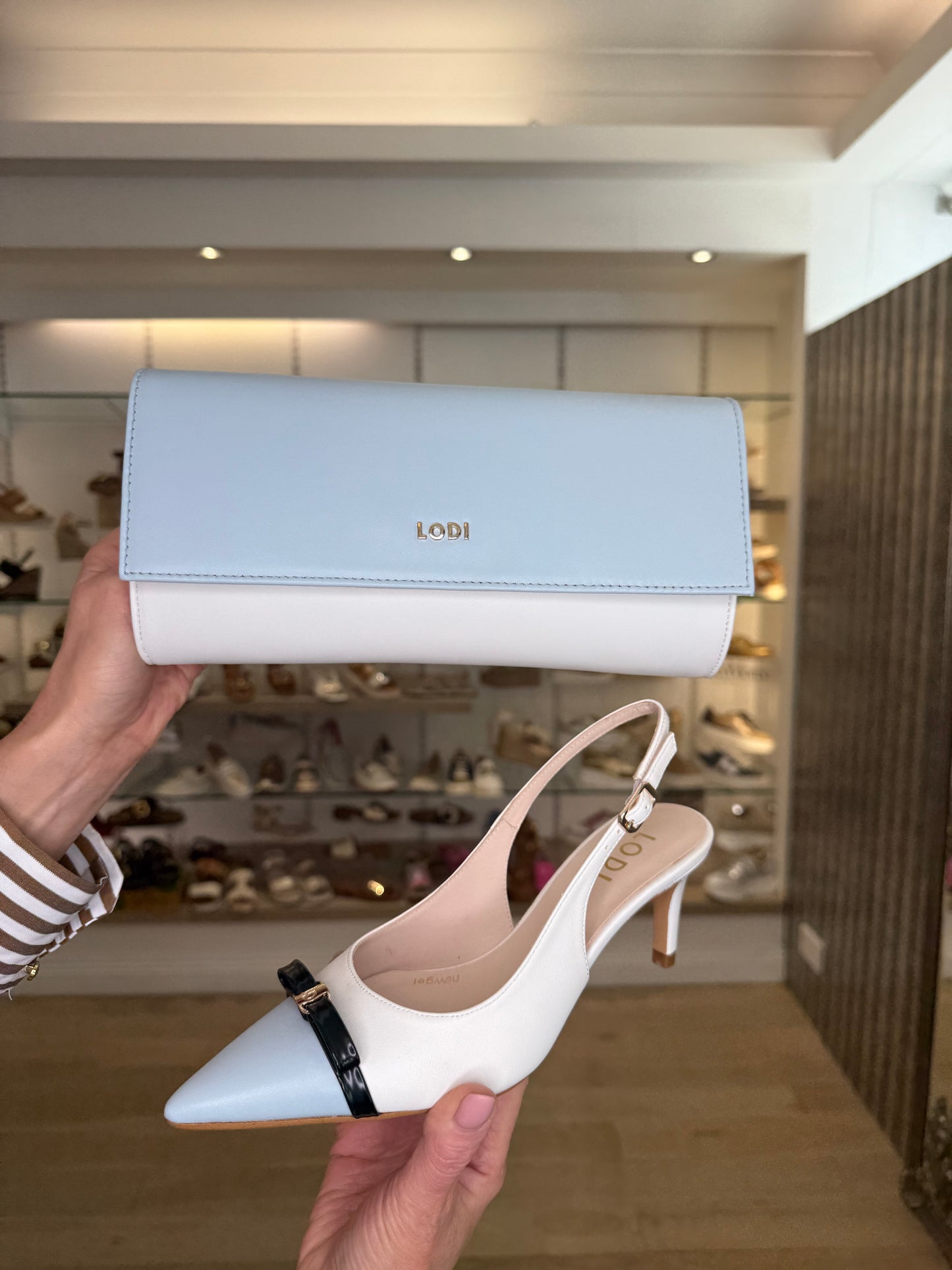 Lodi -White Leather & Powder Blue Pointy Toe Sling Back Court Shoe With Black Bow Trim