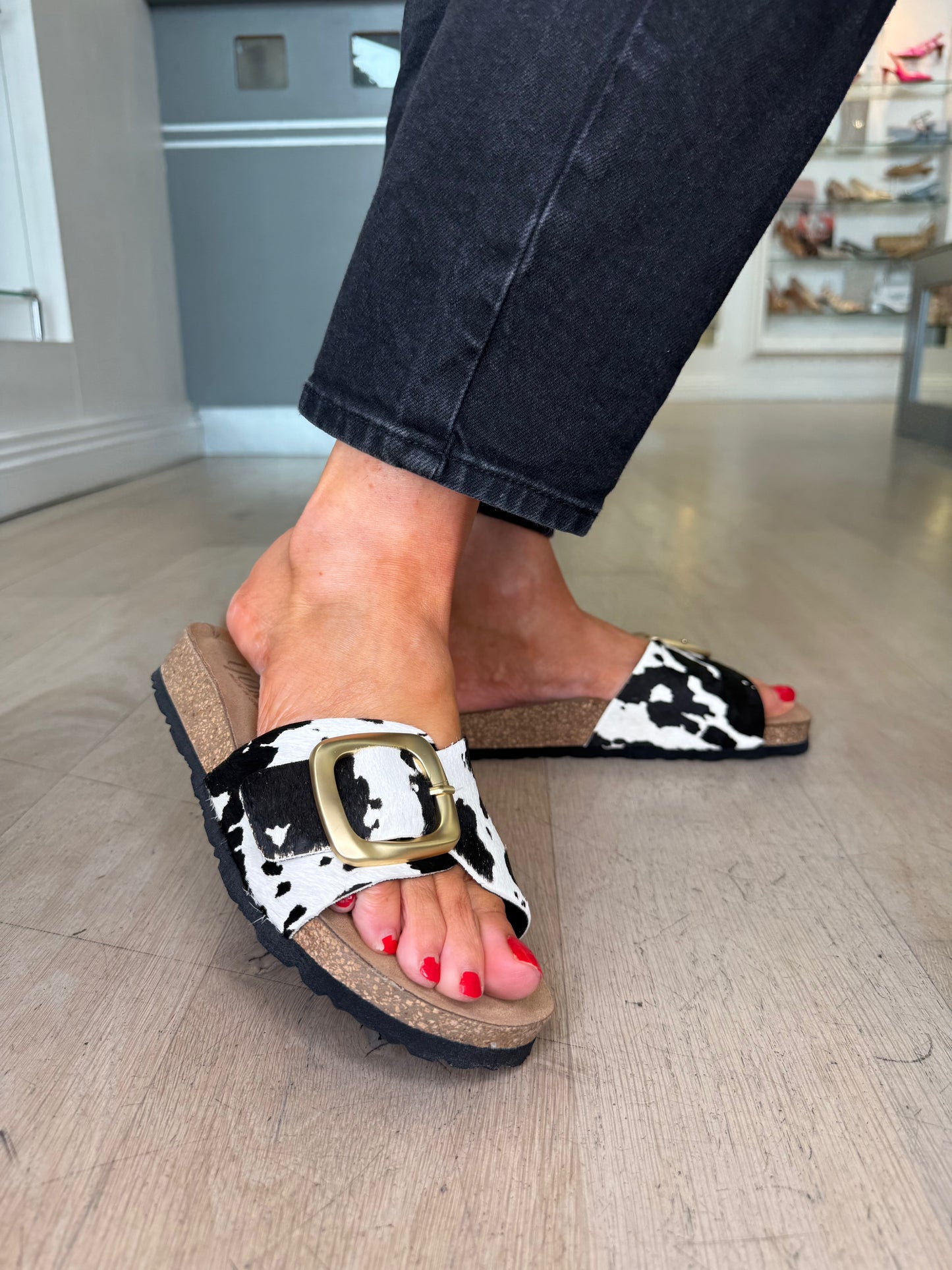 Yokono - Black & White Cow Print Slider With Antique Gold Buckle Trim